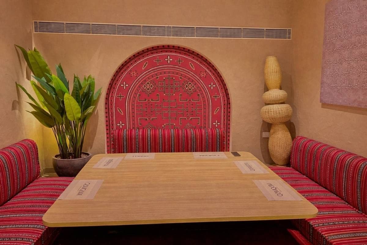 Traditional majlis booth seating at QumQum