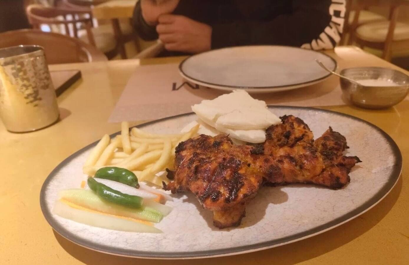 Charcoal alfaham with kuboos, fries, and pickles — QumQum